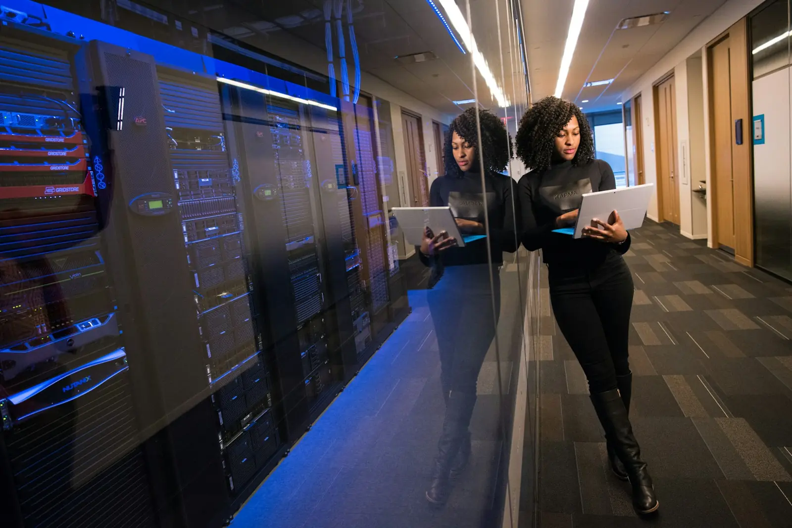 Engineers reviewing systems in a server room